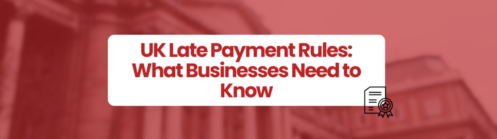 Graphic with a red background showing a blurred building. Centered is a white rounded rectangle containing bold red text that reads: ‘UK Late Payments Rules: What Businesses Need to Know.’ In the lower right corner, there is a small icon of a document with a ribbon or badge.